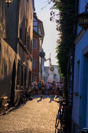 Konstanz, Germany - July 4, 2025: Event Gassenfreitag (Alley friday) in the evening with open bars and restaurants in Constance.のeditorial素材