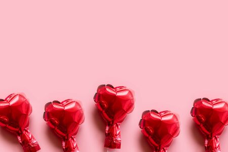 border of red foil balloons hearts on pink background: Valentines day cardの写真素材