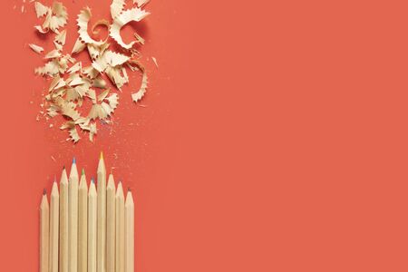 color pencil shavings and pencils on a red background back to school backdrop for your project with...