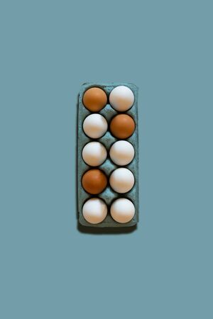 egg carton on a blue background Easter trendy stylish vertical backdropの写真素材