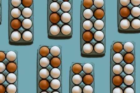 egg cartons pattern on a blue background Easter trendy stylish backdrop