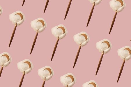 rose gold metallic spoon with powder pattern on a pink backgroundの写真素材