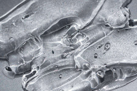 transparent gel texture on a metallic silver background beauty treatment concept