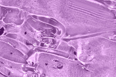 transparent gel texture on purple background luxury beauty treatment toned amethyst orchidの写真素材