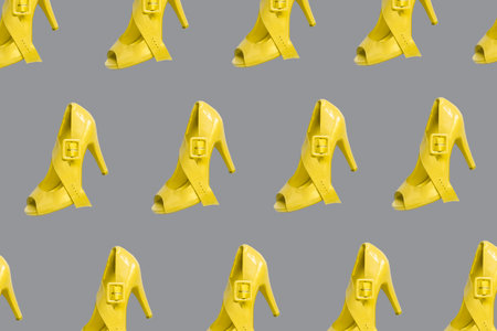 pattern of high heel shoes with 2021 trendy colors illuminating yellow and ultimate grayの写真素材