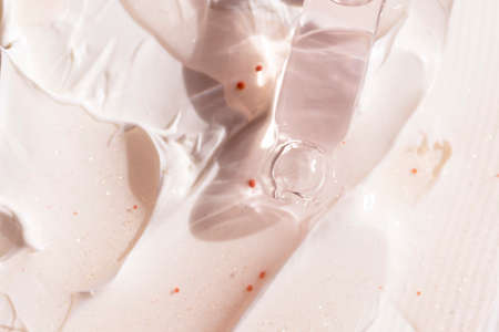 close up of pipette dropper and texture of different cosmetic cream and serum products with selective focusの写真素材
