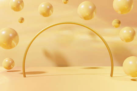3d render of yellow and coral flying marble balls with a metallic arch on a yellow background for your beauty projectの写真素材