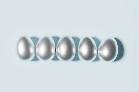 3d render of silver easter eggs on a sky blue background for a spring Easter project with copy space