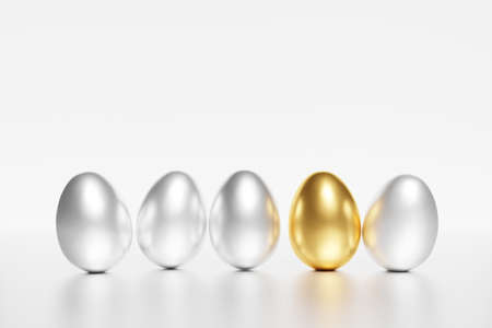 3d render of silver and gold easter eggs on a white background for a spring Easter project with copy spaceの写真素材