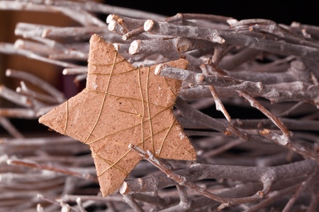 christmas star decoration with wooden branchesの写真素材