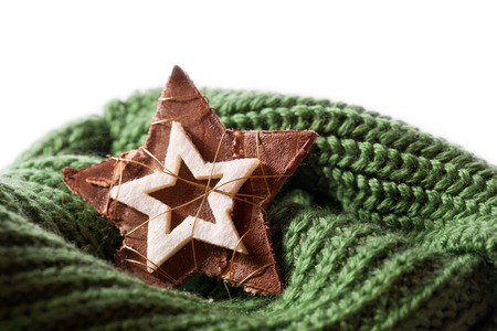 winter decoration green scarf and wooden starの写真素材