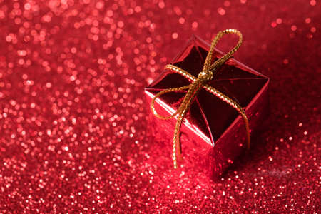gift box present for christmas on red backgroundの写真素材