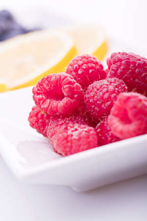 fresh lemon raspberry blueberry in bowl