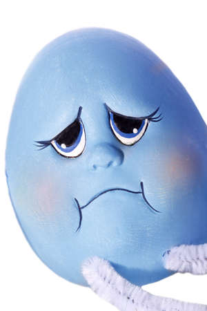 a blue easter egg looks sadの写真素材