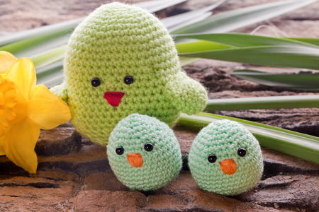 handmade chick with spring flowers as decoration