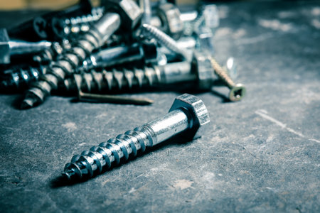 Different Kind of Screws on a table in a workshopの写真素材