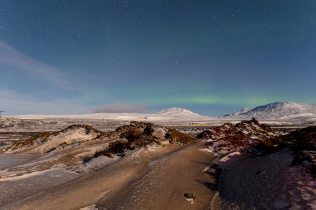 Aurora borealis in Iceland. Winter landscape with starry skyの写真素材