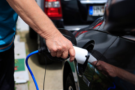 E-mobility, charging an electric car.の写真素材