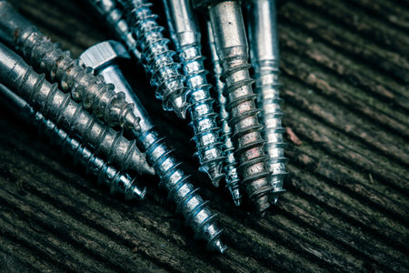 Different Kind of Screws on a table in a workshopの写真素材