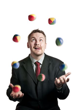 A Businessman juggling balls on white backgroundの写真素材