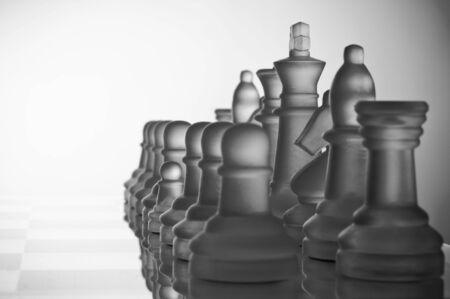 A small pawn with large other chess-piecesの写真素材