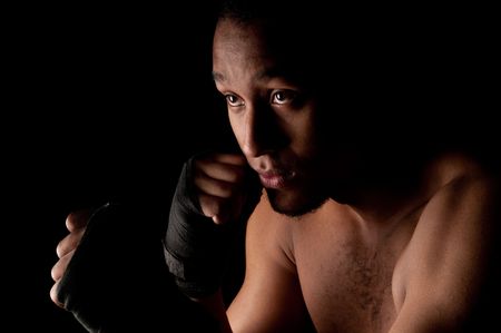 Young fighter male holding guardの写真素材