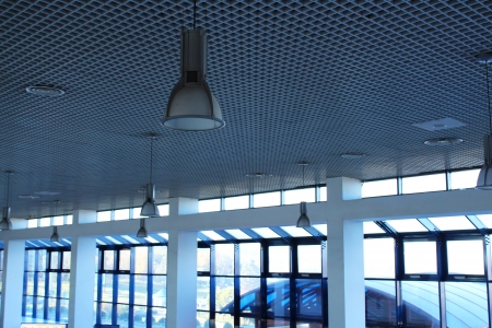 Airport terminal ceiling with lights and ventilation greedsの写真素材
