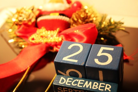 Date cubes and red Merry Christmas ribbonの写真素材