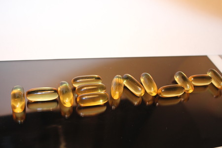 The word  Health  from fish oil capsulesの写真素材