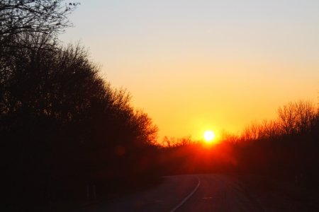 Empty road and sunset aheadの写真素材