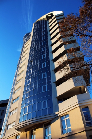 New high rise apartment building and part of bare treeのeditorial素材
