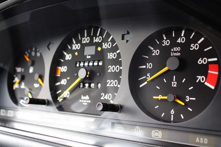 Speedometer and lucky figuresの写真素材