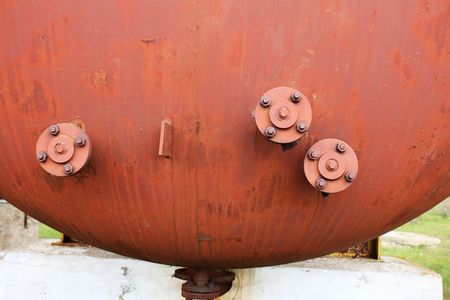 Rusty cylinder with flanges macroの写真素材