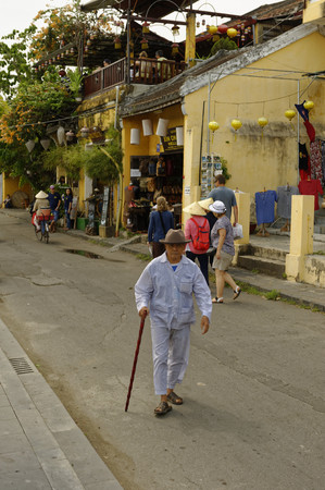 Grandpa goes out in pajamas - Silk and tailor town HOI AN, VIETNAMのeditorial素材