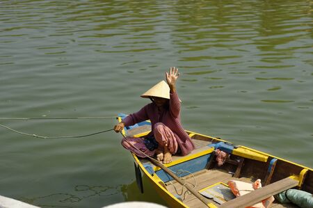 Grandma is looking to the other side of the river - Silk and tailor town HOI AN, VIETNAMのeditorial素材