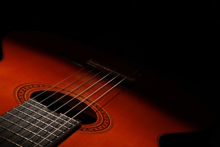 Classical acoustic guitar in low lightの写真素材