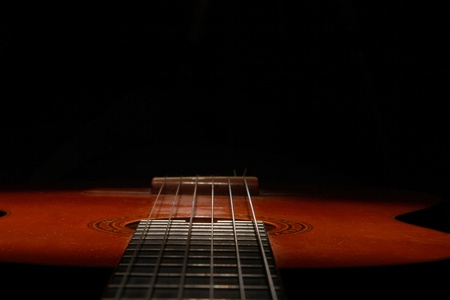 Classical acoustic guitar in low lightの写真素材