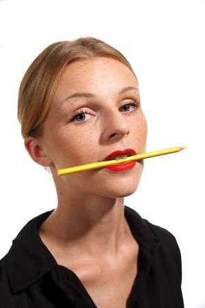 Attractive young woman with auburn hair and red lipstickの写真素材