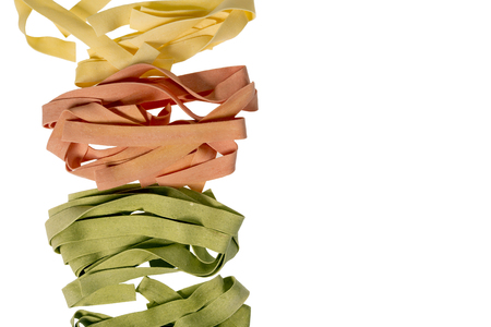 Different colored pasta on a white backgroundの写真素材