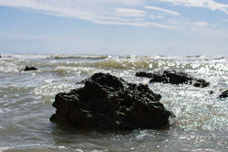Coast of Sicily Italy with large rocks and big wavesの写真素材