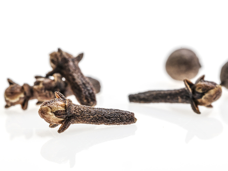 Closeup of pile of clove seeds on white backroundの写真素材