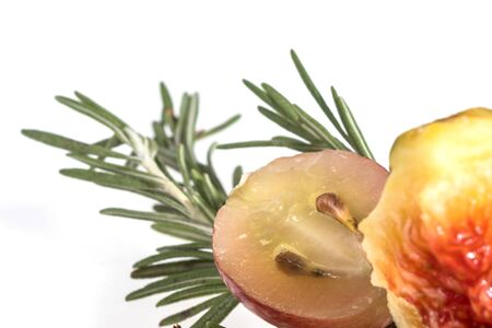 Slice of grape with twig of rosemary and figの写真素材