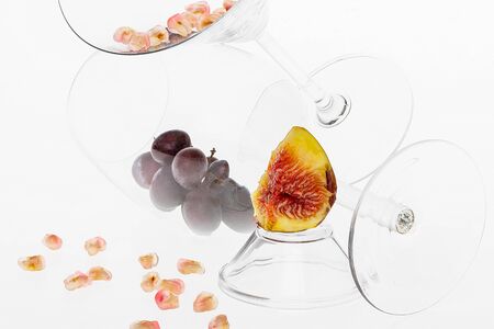 Glass and fruit composition on white backgroundの写真素材