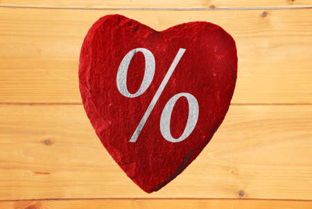 red heart percent with wooden backgroundの写真素材