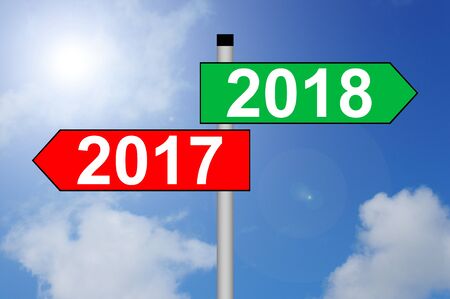 Turn of the year 2017 to 2018 Direction Sign with sky backgroundの写真素材