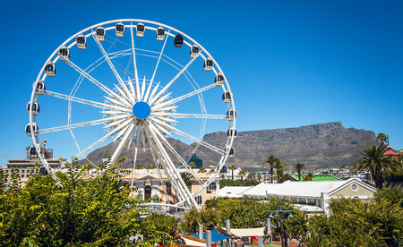 Ferris wheel at the waterfront in Cape Town with Table Mountainのeditorial素材