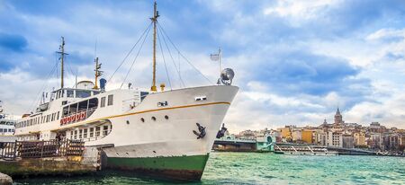 Ship in the port of Istanbul Turkey in the background Galata Bridge and Galata Tower
