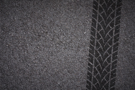 Tire track on asphalt textureの写真素材