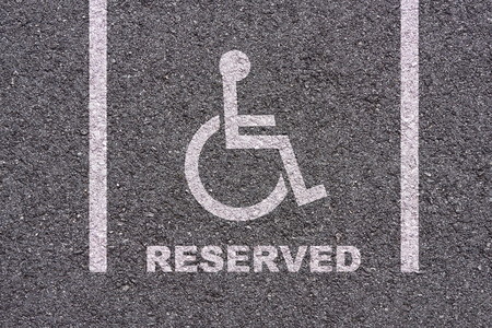 Handicapped parking bay on asphalt background textureの写真素材