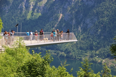 Hallstatt, Austria - June 18, 2017: The World Heritage viewing platform in Hallstatt with a spectacular view of Lake Hallstatter See and the surrounding mountains. People on it. Europe.のeditorial素材